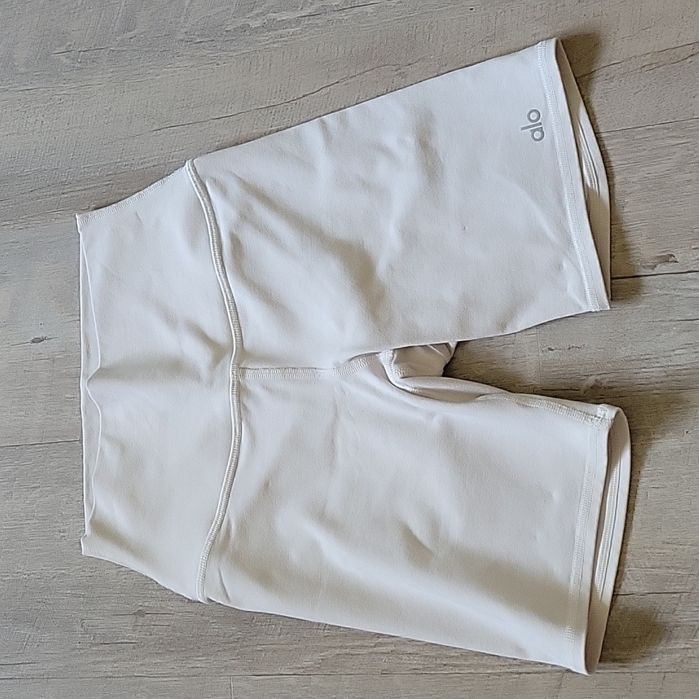 Alo Yoga biker shorts in size XS and cream color